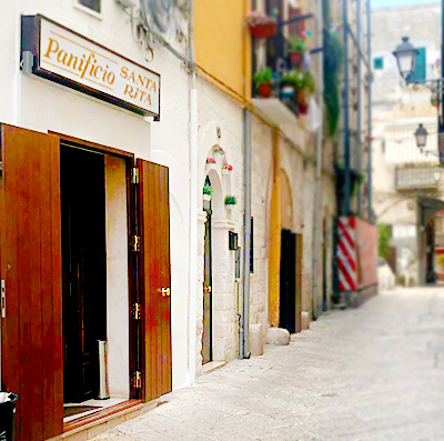 Eating focaccia Bari Vecchia Italy Puglia